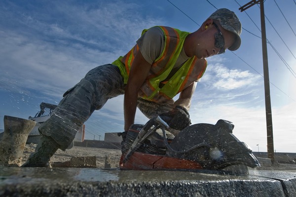 Contractor cutting concrete for removal